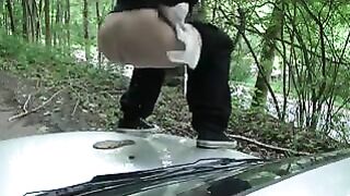 Girl shitting on a white car hood
