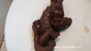 Milf pooping a big load while pissing