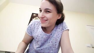 Girl pooping in a plastic bowl