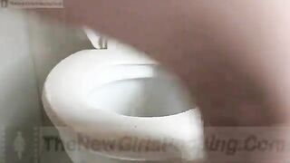 Girl pooping in a toilet bowl