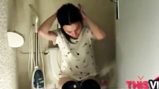 Woman takes a huge shit while sitting on the toilet