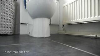 Girl in plaid shorts squats and takes a huge shit on the floor