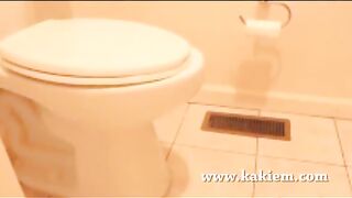 Slutty brunette babe poops in the toilet