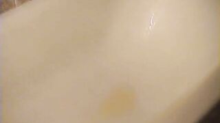 Shaved pussy lady pissing and pooping at home