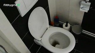 Cute teen in glasses pooping in the toilet