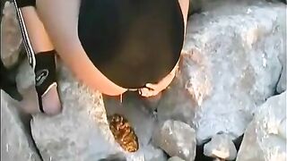 Hot gal poops on the rock