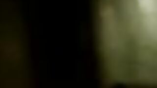 Woman plays with a huge pile of shit on the floor