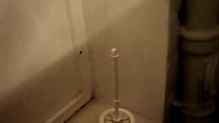 Woman plays with a huge pile of shit on the floor