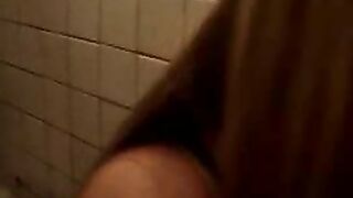 Woman plays with a huge pile of shit on the floor