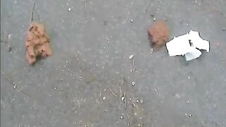 Girls shitting on the rainy road