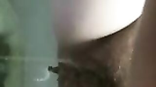 Girl shits on a bathroom toilet