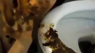 Woman eats shit out of the toilet