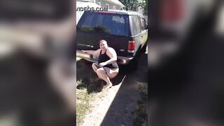BBW slut pooping behind the truck
