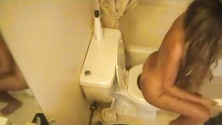 Tanned hot blonde girl poops in the toilet