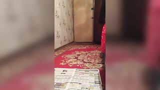 Lady pooping heavily on the newspaper