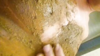 Rubbing shit on her body