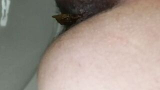 Woman takes a shit in the bathtub