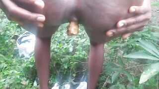 African lady pooping and smearing shit