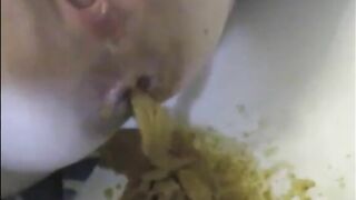 After enema woman shitting the bathtub
