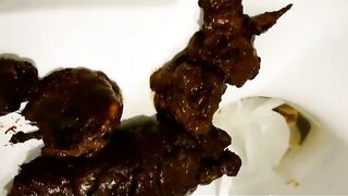 Lovely round ass girl teasing and dropping poop