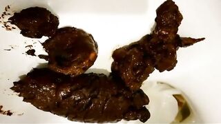 Lovely round ass girl teasing and dropping poop