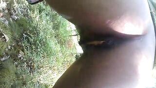 Black sexy girl pooping outdoor