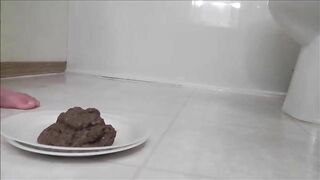Brunette naughty girl shitting in a white plate