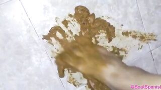 Playing with her poop with her feet