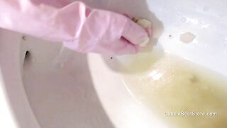 Digging through clogged toilet at home