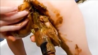 Dirty girl masturbating with a lot of shit