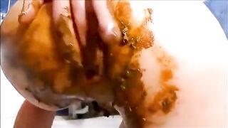 Dirty girl masturbating with a lot of shit