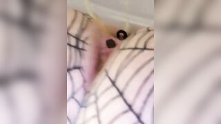 Girl lays on her side and takes a big shit on the bed