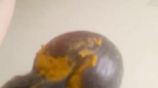 Yellow shit on black dildo