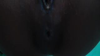 Ebony babe shitting in close up