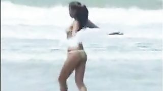 Indian girl shitting on the sand