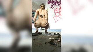 Girl in bikini squats to take a huge shit on the floor