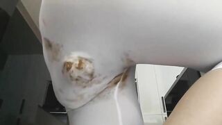 Sexy girl in her tight pants poop
