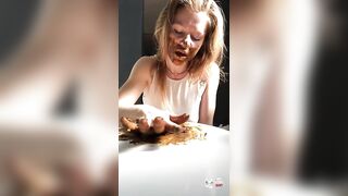 Pretty brunette girl eating shit