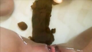 Shitting big turd in the water