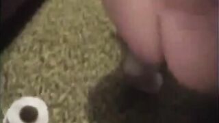 Girl in school uniform spreads her ass cheeks on the toilet