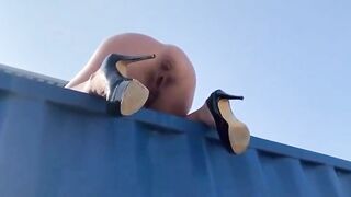Naughty lady pooping from the container