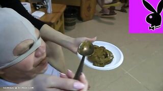 Spoon feeding a slave with creamy poo