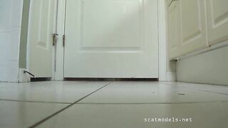 Naked girl teasing and pooping on clear floor