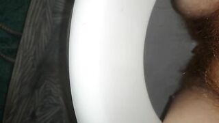 Woman poops in toilet with blue matt