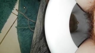 Woman poops in toilet with blue matt