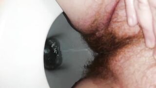 Girl takes giant shit in the toilet from a crouched position