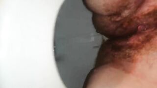 Girl takes giant shit in the toilet from a crouched position