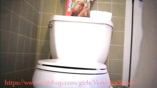 Veronica dropping giant logs in her toilet