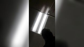 Man sticks his tongue out while wearing a fishnet bodysuit