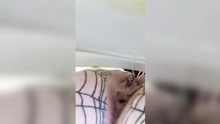 Girl in fishnet stockings with key in her ass